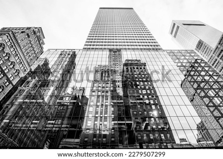 Manhattan street view with big buildings, New York, USA. Black and white