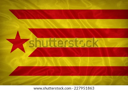 Catalan Socialist Independentist red estelada flag pattern on the fabric texture ,vintage style