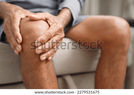 Osteoarthritis is more common in the elderly. Causes knee pain, swelling, redness, stiffness in the knee, clinging noise in the knee. Royalty-Free Stock Photo #2279531675