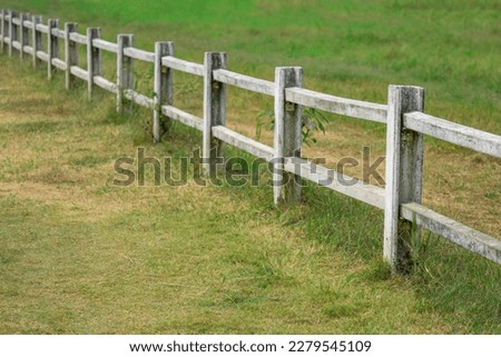 view of white fence in farm field

 Royalty-Free Stock Photo #2279545109