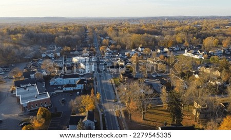 Aerial view Penfield town with local business, residential houses, churches along Five Mile Line Street lush green East Rochester in distant background, Upstate New York, USA. Colorful autumn leaves Royalty-Free Stock Photo #2279545335