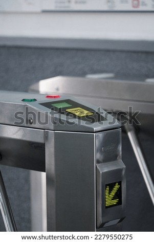 The tripod turnstile with electronic card reader is closed