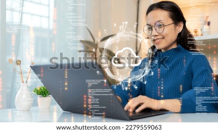 Woman uploading and transferring data from computer to cloud computing. Digital technology concept, data sheet management with large database capacity and high security. Royalty-Free Stock Photo #2279559063