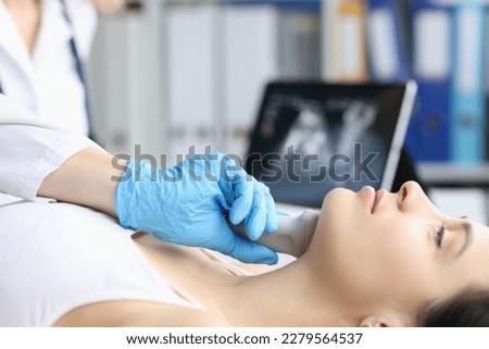 Ultrasound of the soft tissues of face of woman in medical office Royalty-Free Stock Photo #2279564537