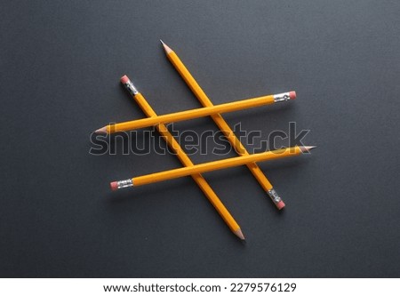 Hashtag from pencils on a dark background