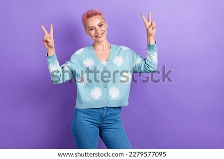 Photo of sweet friendly positive nice woman short hairstyle dressed blue cardigan showing v-sign isolated on purple color background Royalty-Free Stock Photo #2279577095