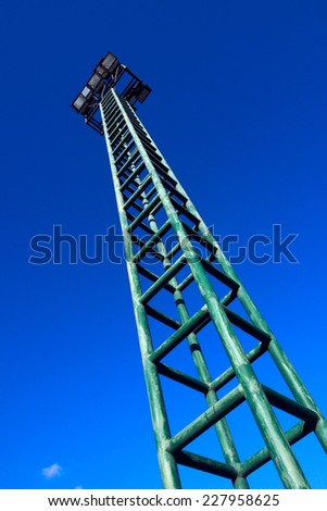 Sportlight tower with blue sky