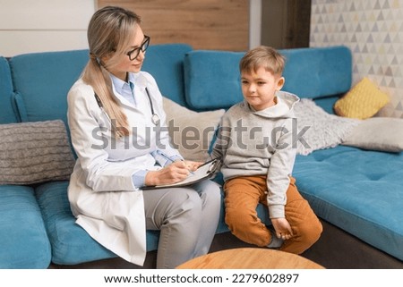 A family doctor examines a little boy at home. Pediatrician girl treats a child