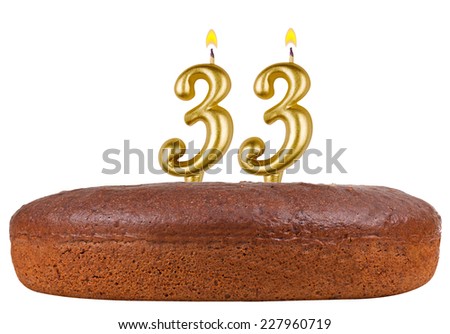 birthday cake with candles number 33 isolated on white background