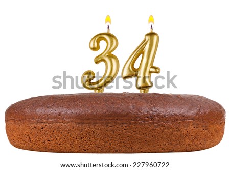 birthday cake with candles number 34 isolated on white background