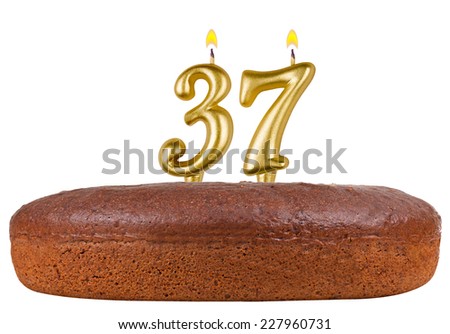 birthday cake with candles number 37 isolated on white background