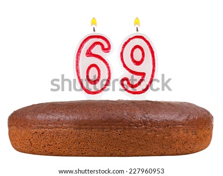 birthday cake with candles number 69 isolated on white background