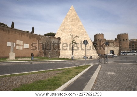 The Pyramid of Cestius and Porta San Paolo in Rome.


