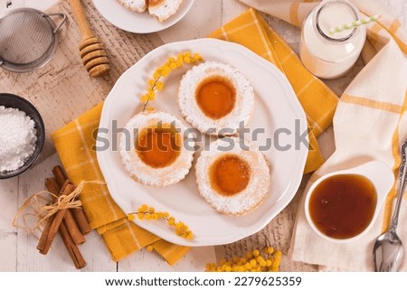 Jam filled butter cookies on white dish. Royalty-Free Stock Photo #2279625359