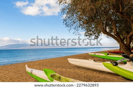Outrigger  Racing Canoes on The Beach With Lania on The Horizon, Hanakao'o Park, Lahaina, Maui, Hawaii, USA Royalty-Free Stock Photo #2279632893