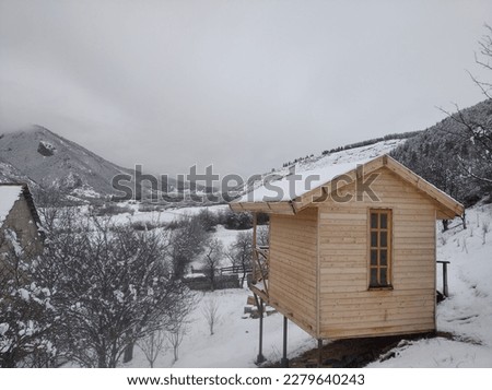 Beautiful snowy api therapy hut in the yard of Organic Farm Barbale, Atskuri, Georgia