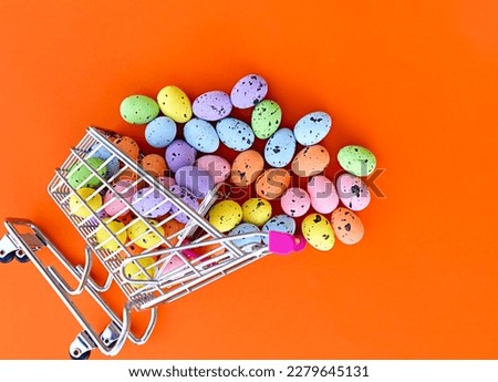 a shopping cart full of decorated easter eggs, overturned cart, easter eggs coming out of the cart, flying easter eggs