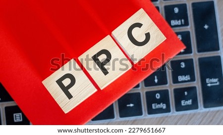 on keyboard notebook cubes with the inscription - PPC, red background