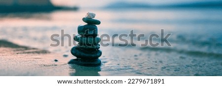 Stones Balance in sunrise at sea in summer
 Royalty-Free Stock Photo #2279671891