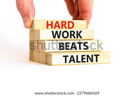 Hard work beats talent symbol. Concept words Hard work beats talent on wooden block. Beautiful white table white background. Motivational business hard work beats talent concept. Copy space.