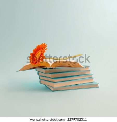 Aesthetic composition of books with colorful flowers on a pastel blue background. Spring or summer book sale and education concept, for book lovers.
