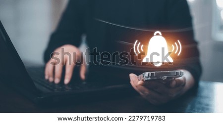 Woman Hand hold smartphone and press the button of Notification bell button on smartphone app screen close up,App Notification on Smart Phone Screen, Remote online alerts, home security signal. Royalty-Free Stock Photo #2279719783