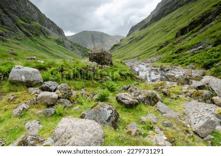 Beautiful landscape with Glencoe or Glen Coe mountains. An beautiful view over landscape in the Scottish Higlands, Scotland. UK. View of the Hidden-valley in the Scottish Highlands. Royalty-Free Stock Photo #2279731291