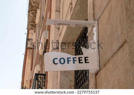 Broken " coffee " sign on the wall of a historic building in Lisbon, Portugal