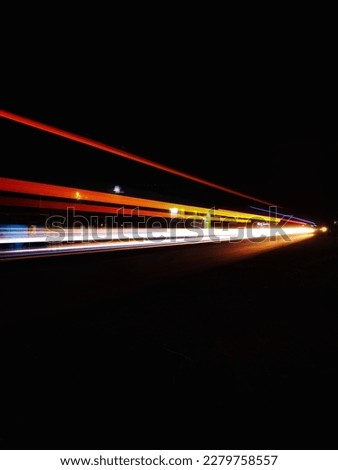 Nighttime in Indonesia's Roadside photographed using a slow shutter speed