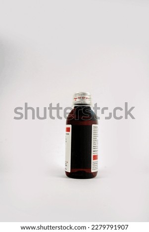 Madical syrup bottle and bottle packaging                                  Royalty-Free Stock Photo #2279791907