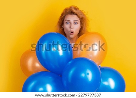 happy birthday girl hold balloons in studio. shocked girl with balloon for birthday party