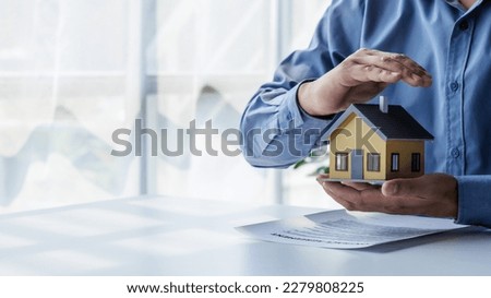 real estate agent Hand over the keys and the model house to the customer and the home insurance contract. home mortgage loan concept Royalty-Free Stock Photo #2279808225