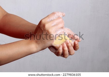 washing hands with soap to maintain health