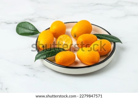 kumquat fruit, chinese tangerine. banner, menu, recipe place for text top view Royalty-Free Stock Photo #2279847571