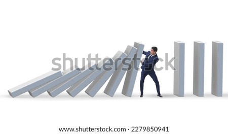 Businessman preventing domino effect in business concept Royalty-Free Stock Photo #2279850941