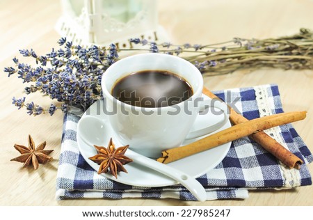 Hot espresso  and lavender flower with cinnamon ,anise on wood table 