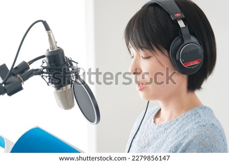 Asian female narrator recording in the studio