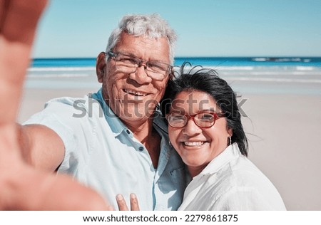 Portrait, selfie and elderly couple at a beach for travel, vacation and bonding against ocean background. Face, love and seniors enjoying retirement, holiday and sea trip, photo and profile picture