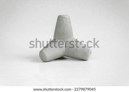 Concrete tetrapod breakwaters. Tetrapod model, design concept Royalty-Free Stock Photo #2279879045