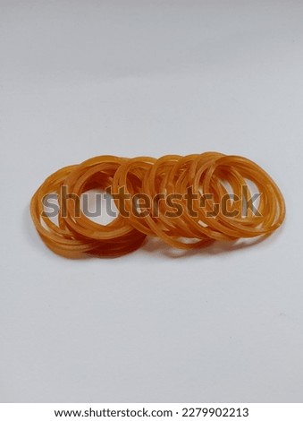 a collection of brownish yellow rubber bands