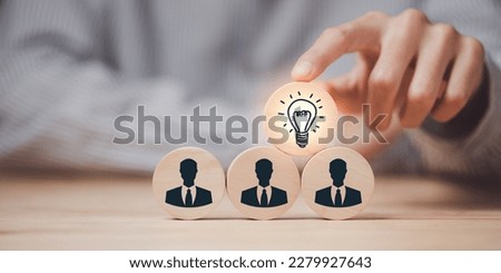 Human hand pointing at a wooden block,Finding new solutions to solve business problems,innovation and brain power from brainstorming,Finding Creativity and Inspiration,successful business ideas Royalty-Free Stock Photo #2279927643