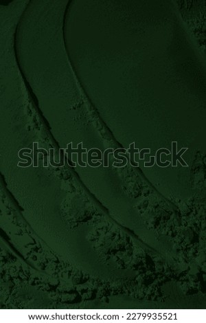 global warming concept, black green background with space for design. Toned rough surface of an old stone wall. Background. Solid. Grunge. green eyeshadow. Craters. green earth