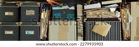 Row of messy file folders,old papers and boxes,red tape,close up, bureaucracy,aministration,business concept Royalty-Free Stock Photo #2279935903