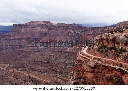 A viewpoint on the beautiful massive canyons of the Canyonlands National Park close to Moab in Utah, blue sky with clouds, amazing nature