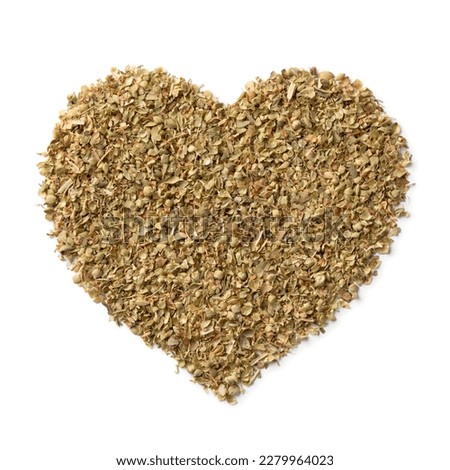 Mediterranean dried za'atar,  in heart shape isolated on white background close up