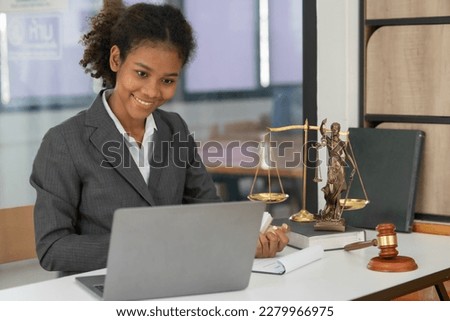 Female lawyer working at client's office discussing documents