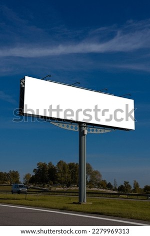 White billboard along the highway. Background for design and advertising. 