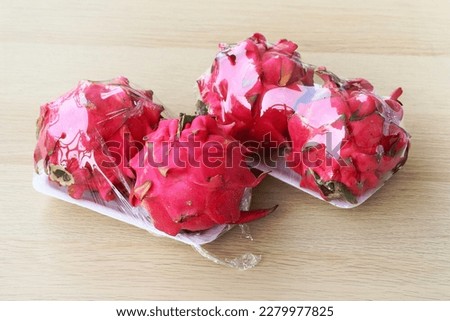 Dragon fruit packed on styrofoam tray and wrapped with transparent plastic