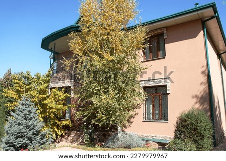 Two story house with trees around