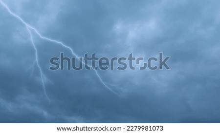 Bad weather, hurricane, storm. Gray rain clouds and lightning covering the sky